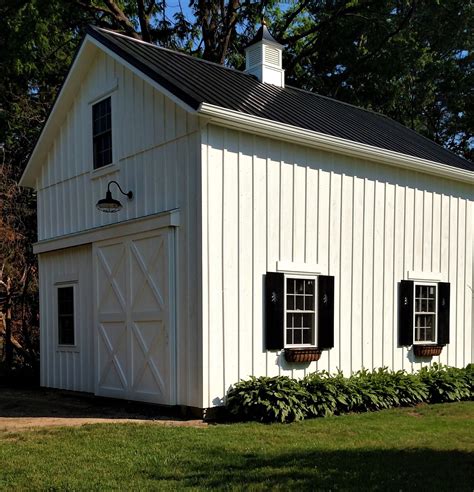 metal house with loft|metal garage with apartment above.